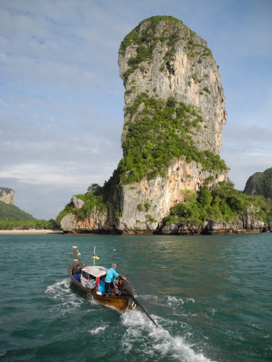 A longtail boat zips toward Railay Beach
